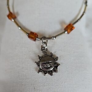 B-016-Handcrafted Sun Charm Silver Tone and Orange Beaded Bracelet